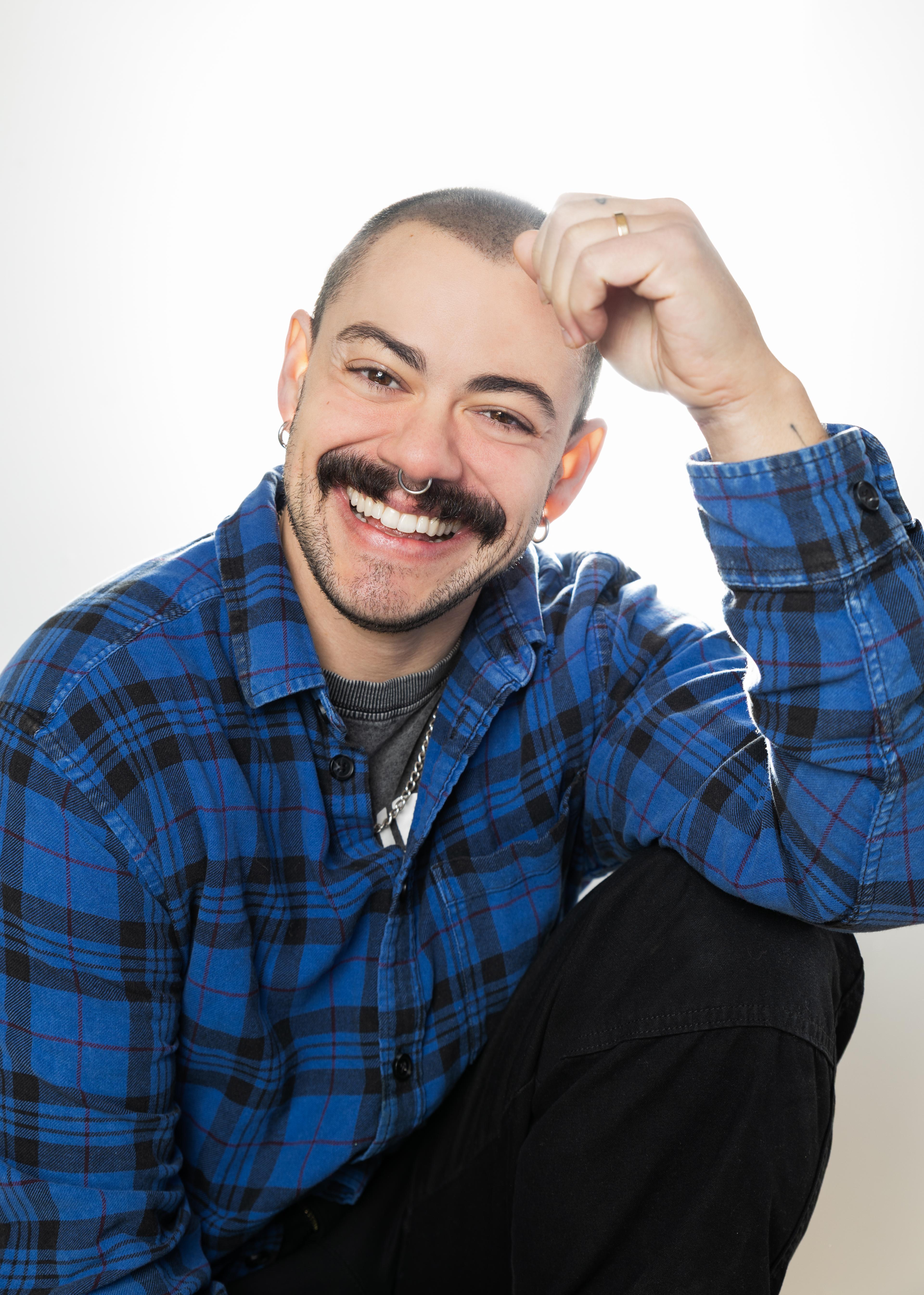 A portrait of a man smiling at the camera.