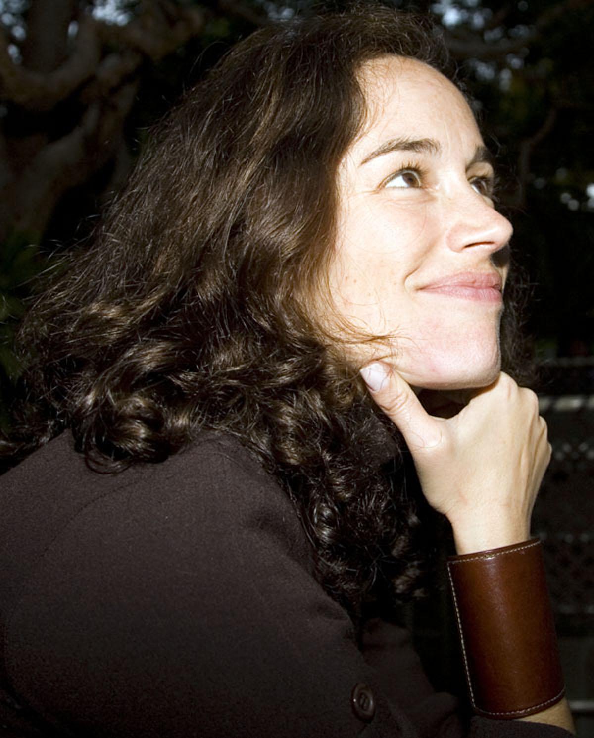 Julia Meltzer looks off smiling.