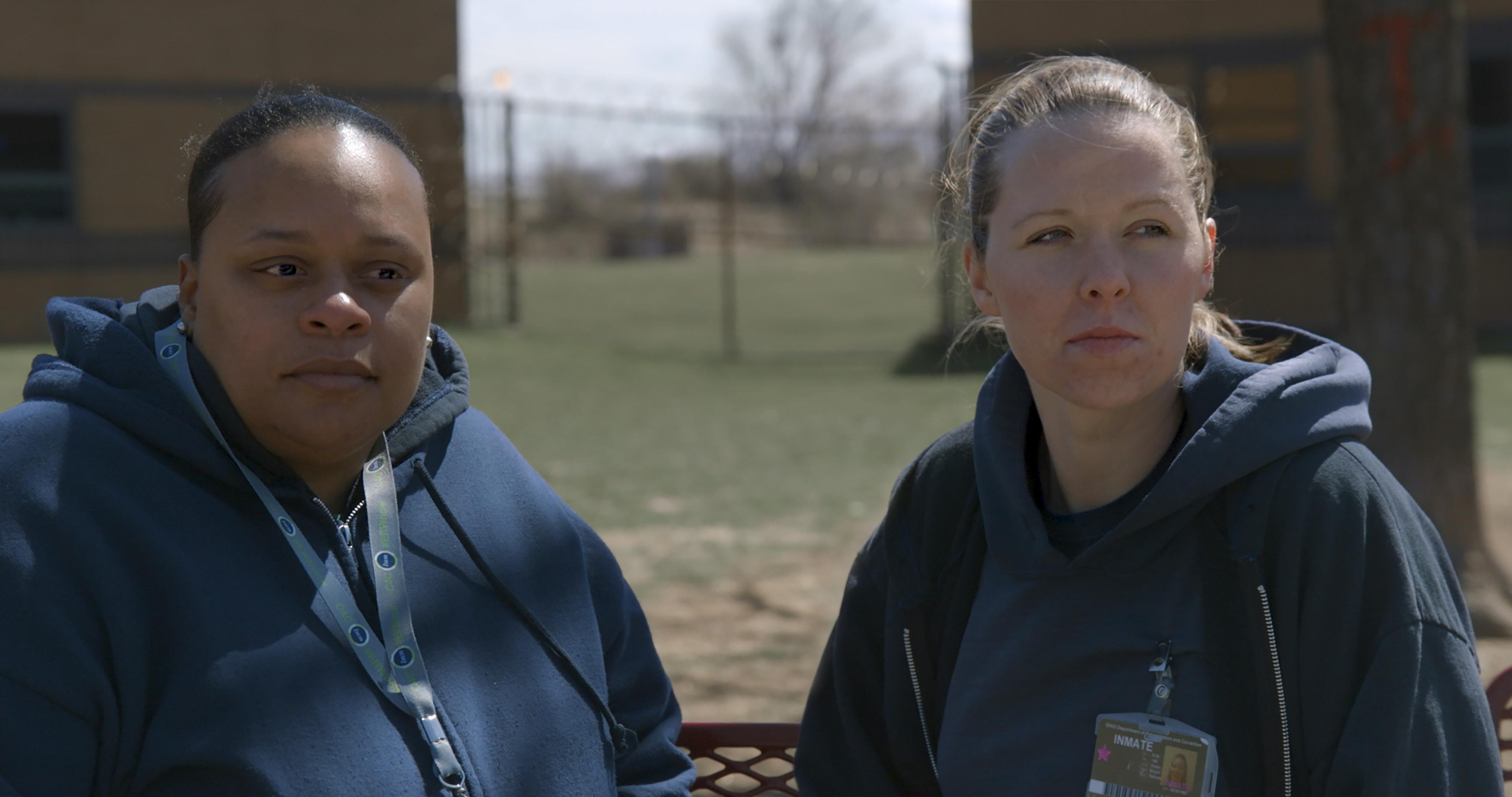 Still from Apart. Tomika and Amanda in the prison yard.