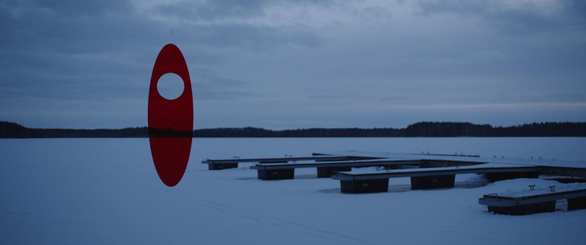 A snowy landscape with a red shape on top of it.